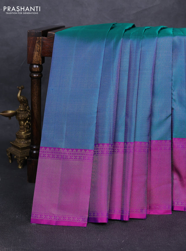 Pure soft silk saree dual shade of teal green and purple with allover zari woven brocade weaves and long zari woven border