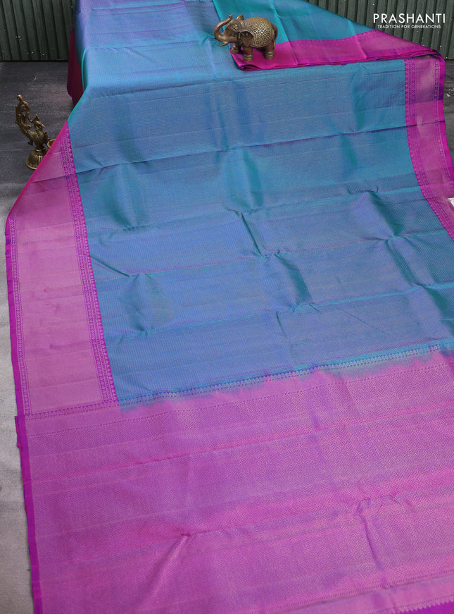 Pure soft silk saree dual shade of teal green and purple with allover zari woven brocade weaves and long zari woven border