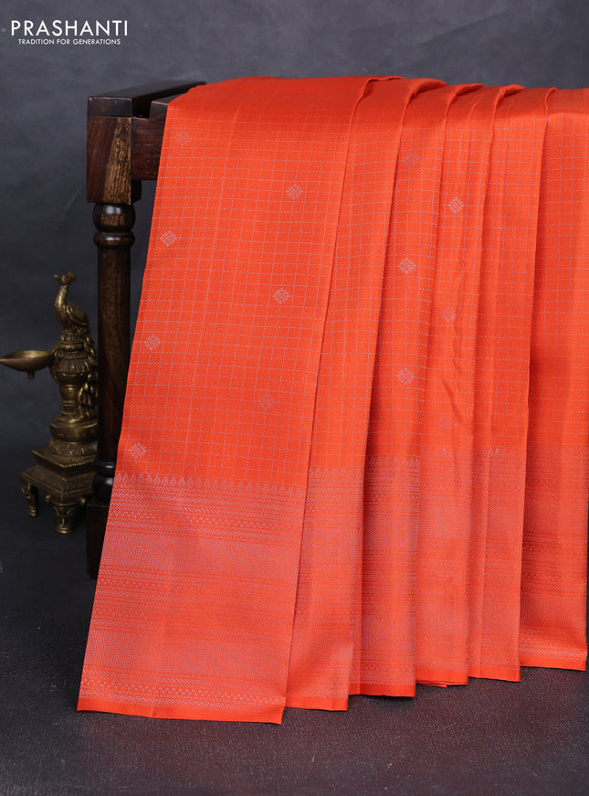 Pure soft silk saree orange with allover silver zari checks & buttas and long silver zari woven border