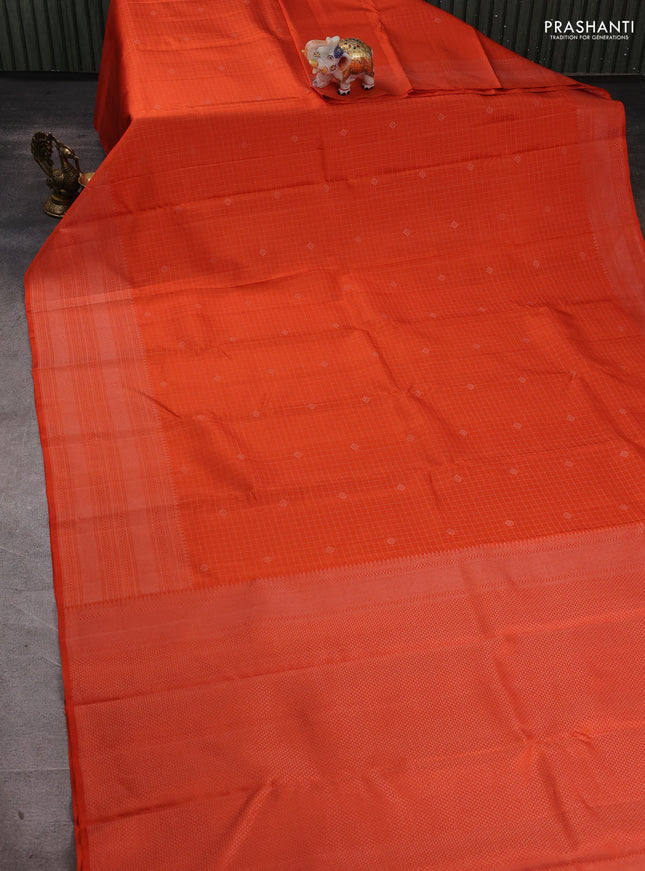 Pure soft silk saree orange with allover silver zari checks & buttas and long silver zari woven border