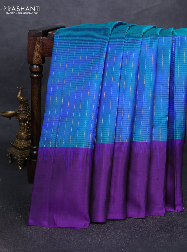 Pure soft silk saree dual shade of teal blue and deep violet with allover silver zari stripe pattern and long silver zari woven butta border