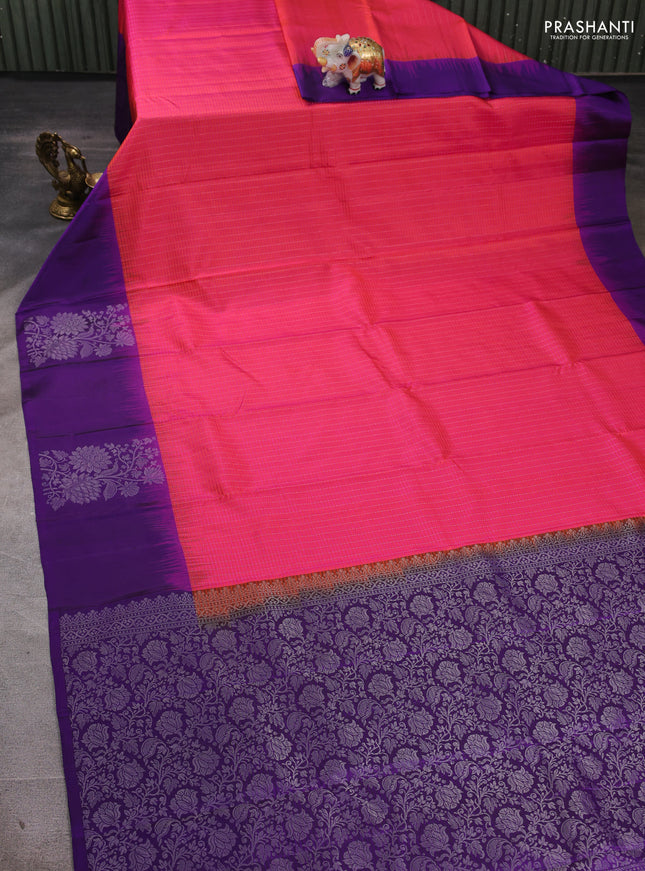 Pure soft silk saree dual shade of pinkish orange and violet with allover silver zari stripe pattern and long silver zari woven butta border