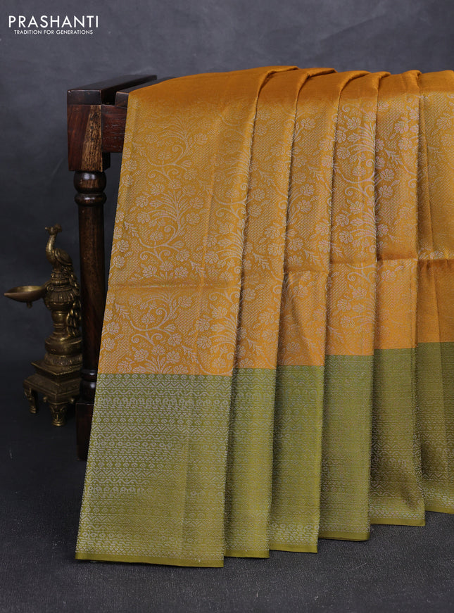 Pure soft silk saree dark mustard and mehendi green with allover silver zari woven brocade weaves and silver zari woven border