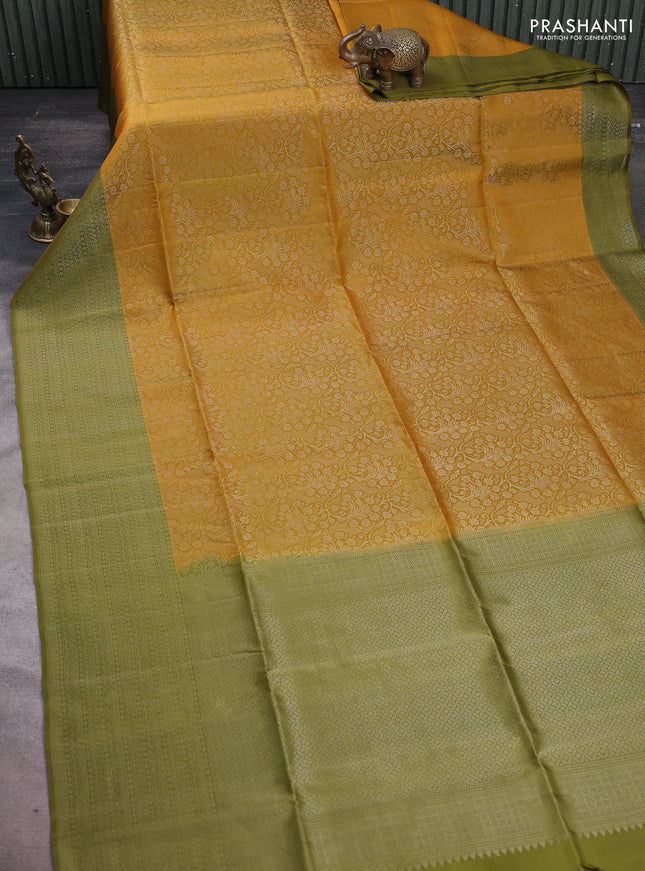 Pure soft silk saree dark mustard and mehendi green with allover silver zari woven brocade weaves and silver zari woven border