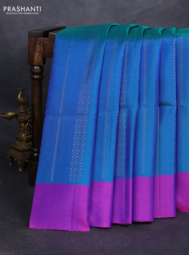 Pure soft silk saree dual shade of bluish green and purple with allover zari weaves and simple border