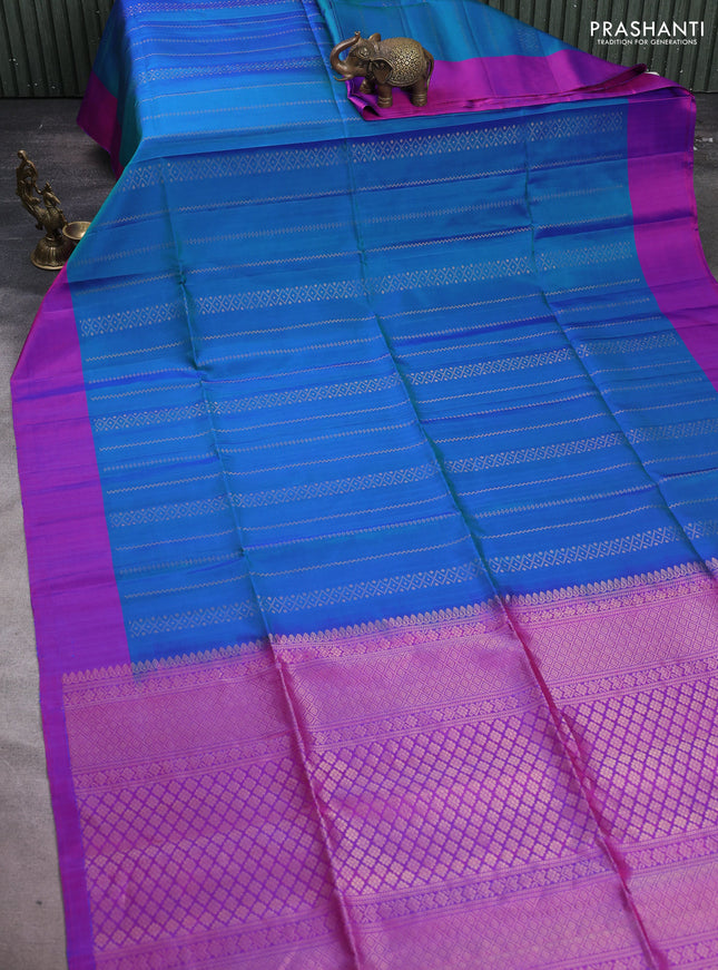 Pure soft silk saree dual shade of bluish green and purple with allover zari weaves and simple border
