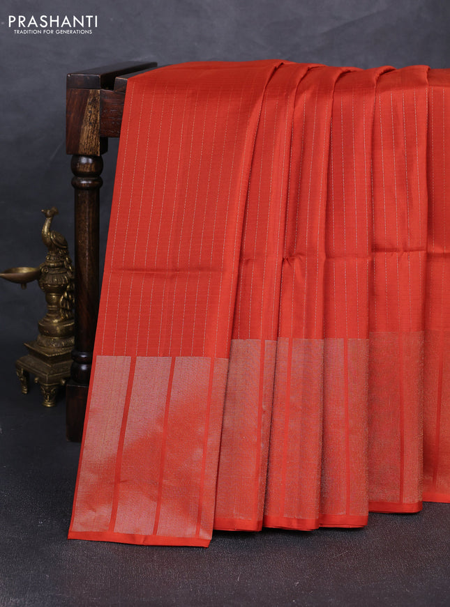 Pure soft silk saree rustic orange with allover zari stripe pattern and long zari woven border
