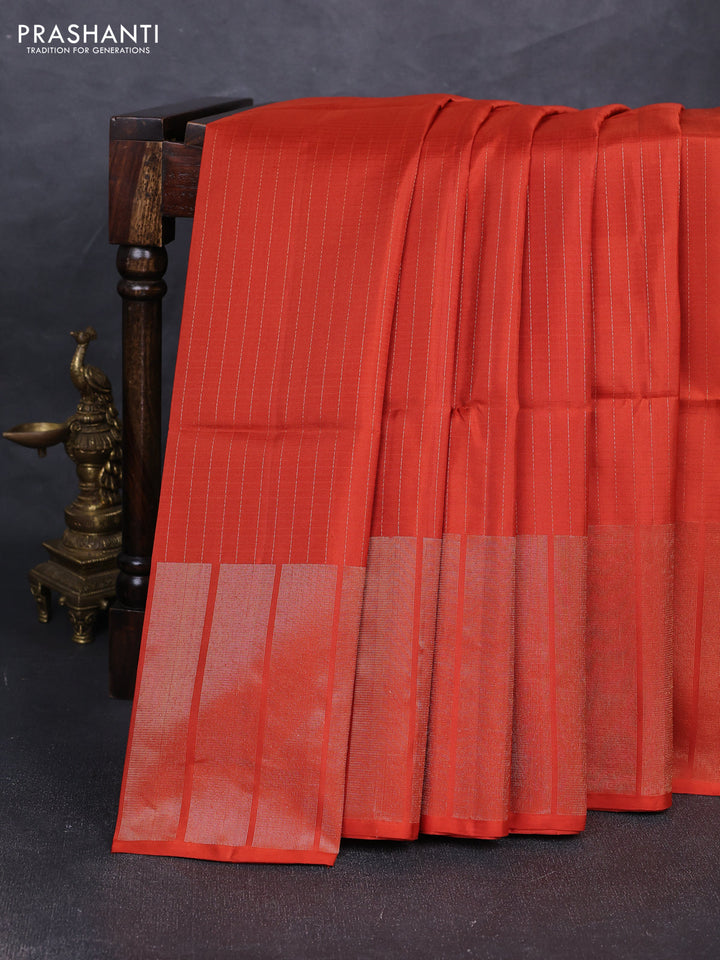 Pure soft silk saree rustic orange with allover zari stripe pattern and long zari woven border