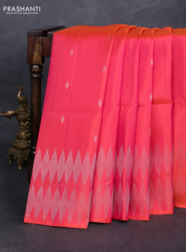 Pure soft silk saree dual shade of pinkish orange with allover silver zari woven buttas and silver zari woven border