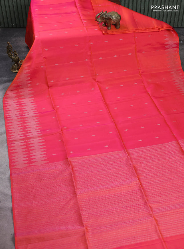 Pure soft silk saree dual shade of pinkish orange with allover silver zari woven buttas and silver zari woven border
