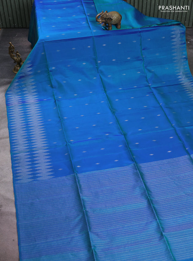 Pure soft silk saree dual shade of bluish green with allover silver zari woven buttas and silver zari woven border