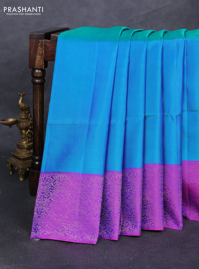 Pure soft silk saree dual shade of greenish blue and purple with plain body and zari woven border