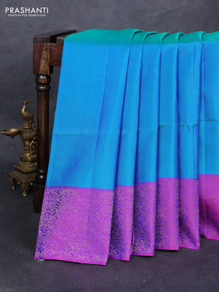 Pure soft silk saree dual shade of greenish blue and purple with plain body and zari woven border