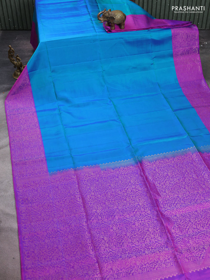 Pure soft silk saree dual shade of greenish blue and purple with plain body and zari woven border