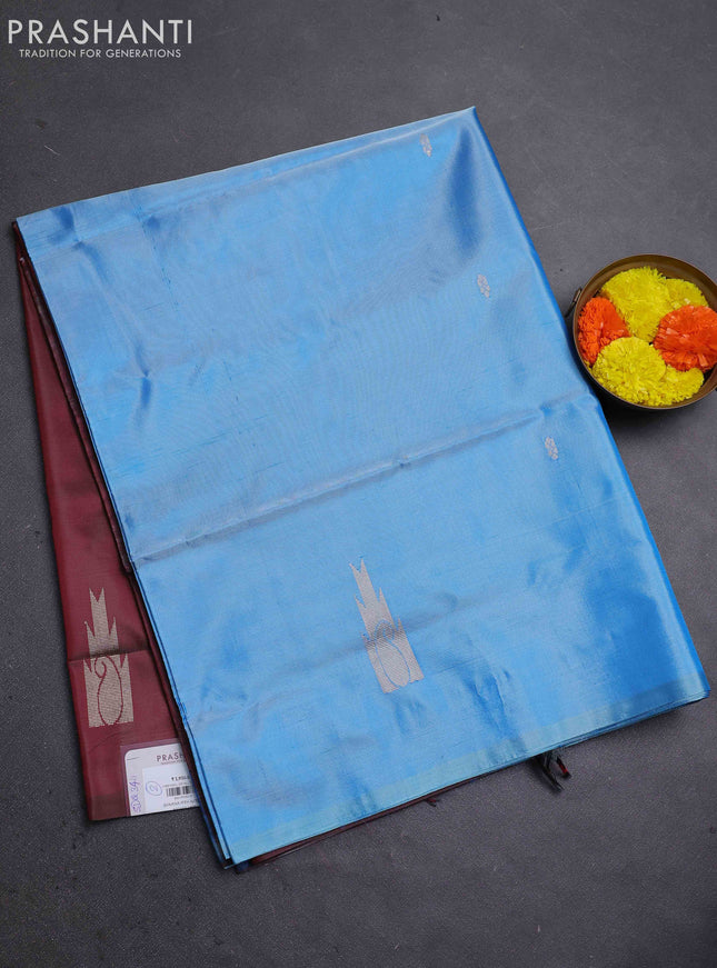 Banana pith saree light blue and maroon with thread woven buttas in borderless style