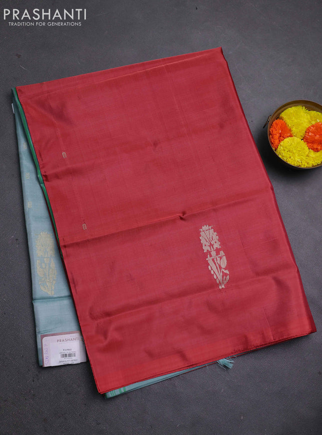 Banana pith saree maroon and pastel blue with thread woven buttas in borderless style