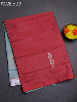 Banana pith saree maroon and pastel blue with thread woven buttas in borderless style