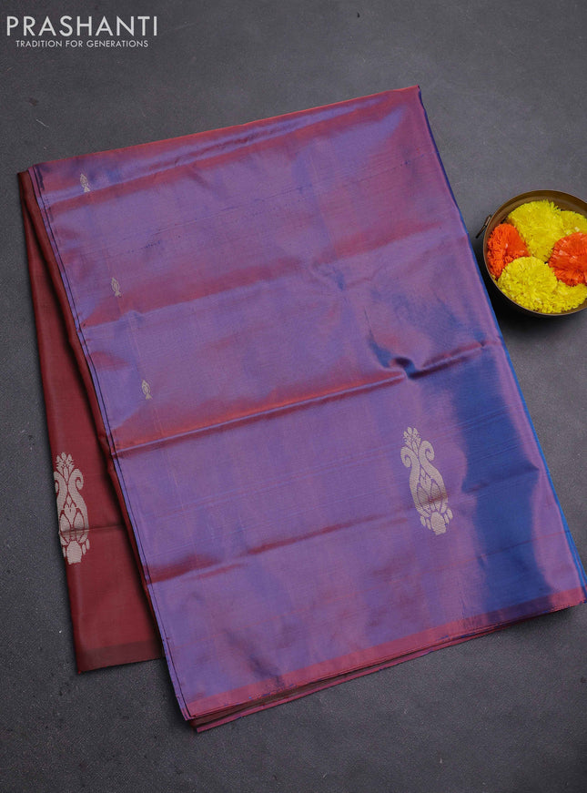 Banana pith saree dual shade of blue and maroon with thread woven buttas in borderless style