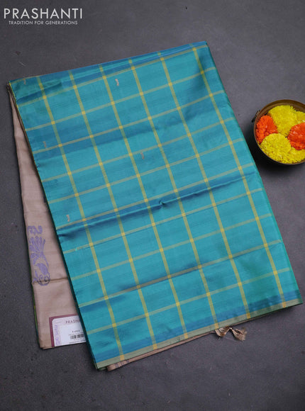 Banana pith saree teal green and beige with allover checked pattern in borderless style