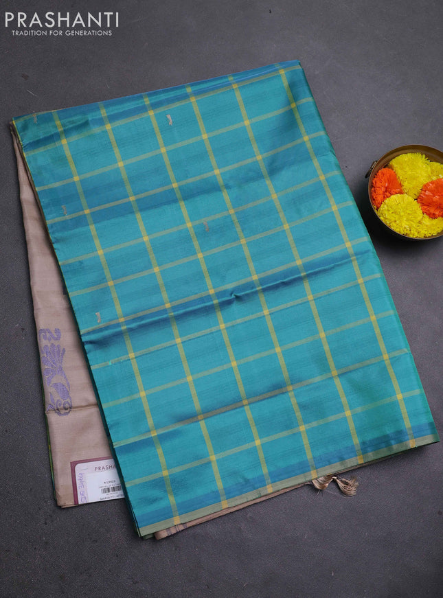 Banana pith saree teal green and beige with allover checked pattern in borderless style