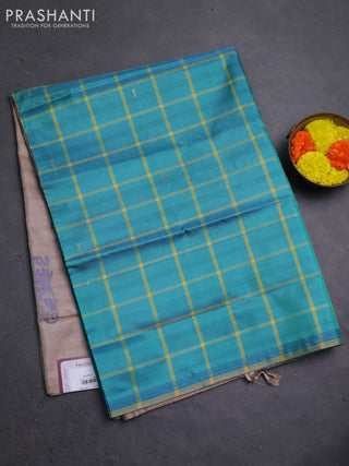 Banana pith saree teal green and beige with allover checked pattern in borderless style