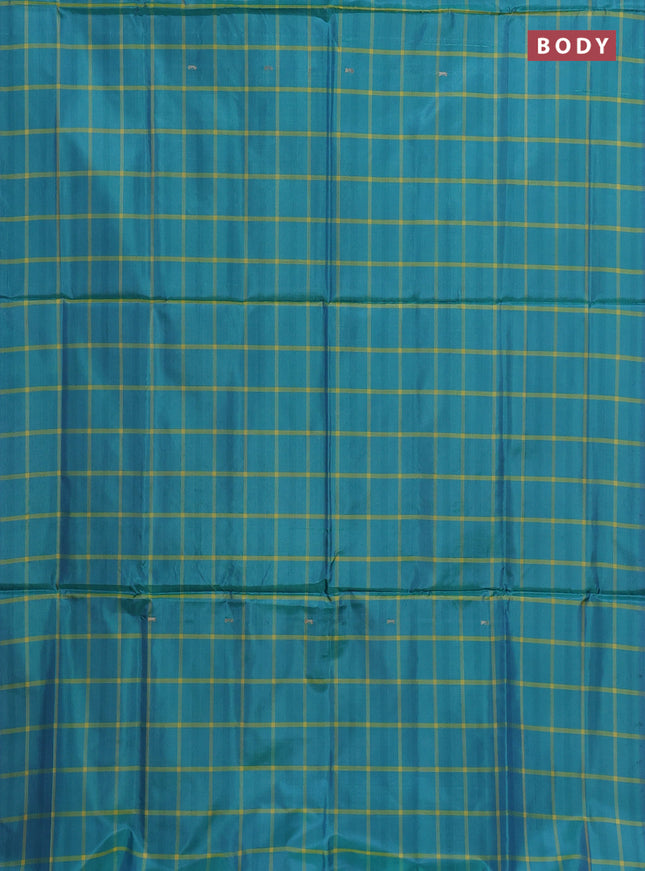 Banana pith saree teal green and beige with allover checked pattern in borderless style