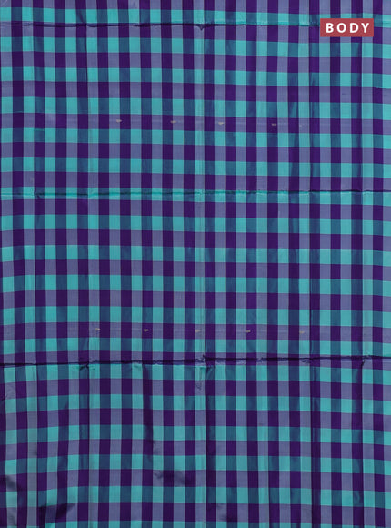 Banana pith saree teal green and violet with allover checked pattern in borderless style