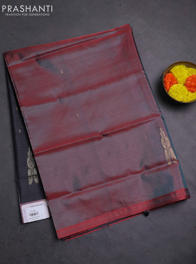 Banana pith saree dual shade of maroon and black with thread woven buttas in borderless style