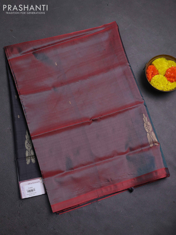 Banana pith saree dual shade of maroon and black with thread woven buttas in borderless style