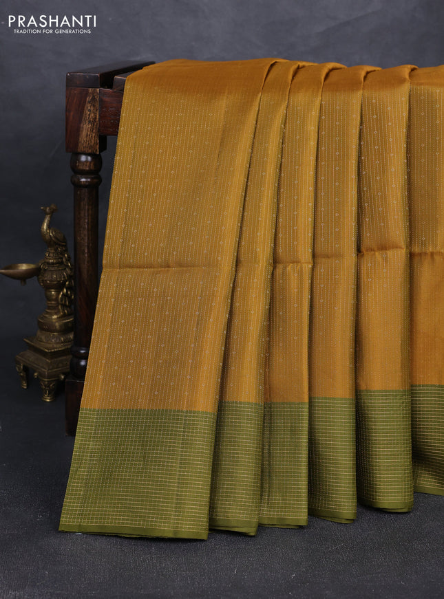Pure soft silk saree dark mustard and olive green with allover zari woven brocade weaves and zari woven checked border