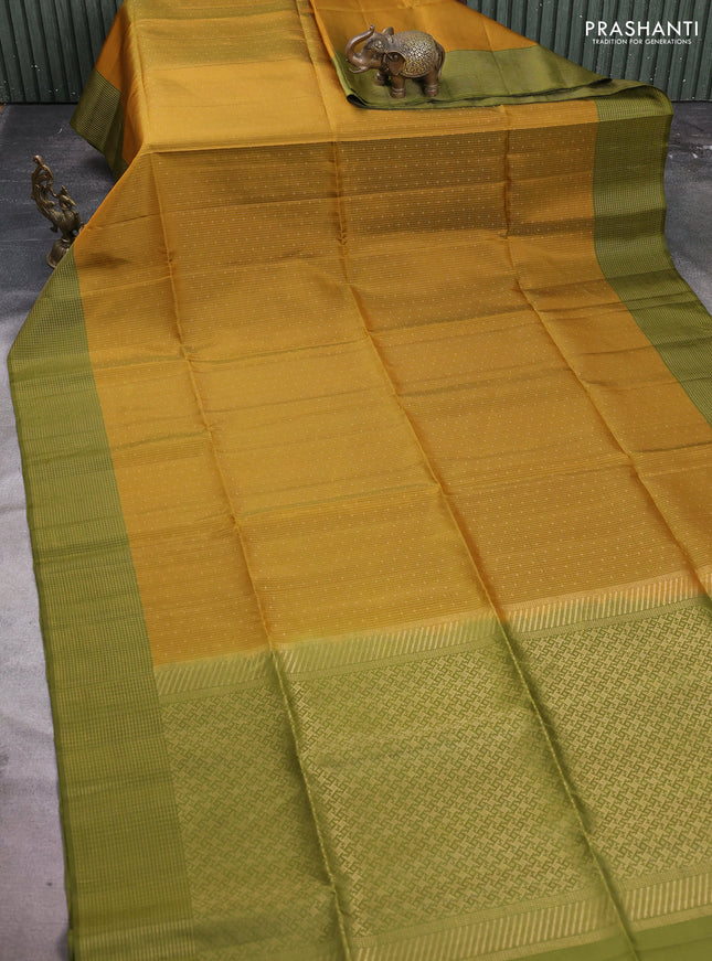 Pure soft silk saree dark mustard and olive green with allover zari woven brocade weaves and zari woven checked border