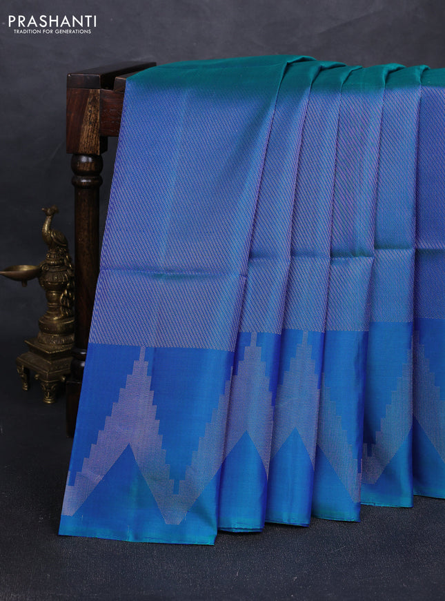 Pure soft silk saree dual shade of bluish green with allover silver zari woven brocade weaves and temple design silver zari woven border