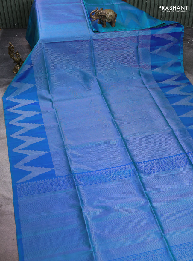 Pure soft silk saree dual shade of bluish green with allover silver zari woven brocade weaves and temple design silver zari woven border
