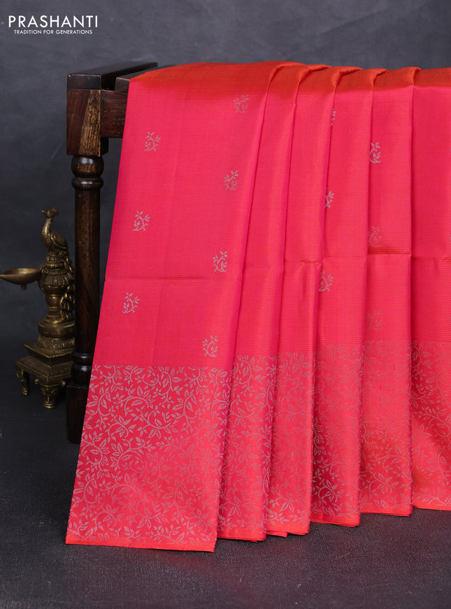 Pure soft silk saree dual shade of pinkish orange with silver zari woven buttas and silver zari woven border