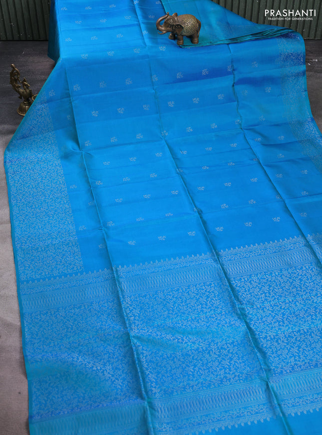 Pure soft silk saree dual shade of bluish green with silver zari woven buttas and silver zari woven border