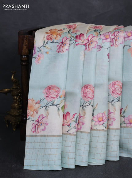 Pure tussar silk saree mild teal and off white with allover floral prints and zari woven checked border