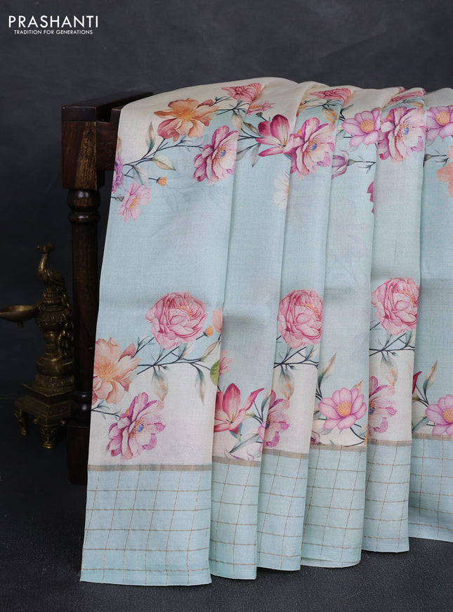 Pure tussar silk saree mild teal and off white with allover floral prints and zari woven checked border