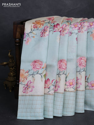 Pure tussar silk saree mild teal and off white with allover floral prints and zari woven checked border