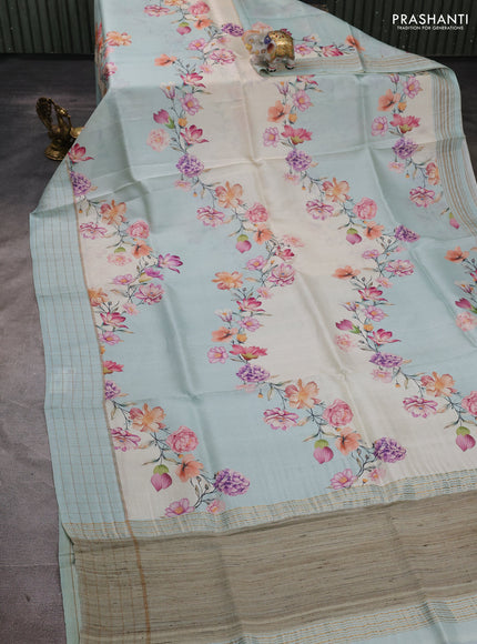 Pure tussar silk saree mild teal and off white with allover floral prints and zari woven checked border