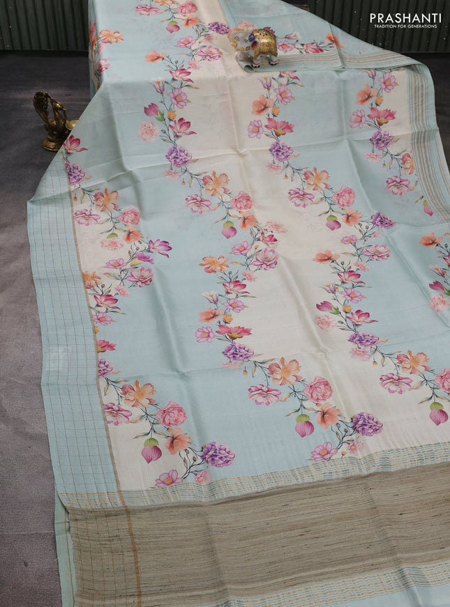 Pure tussar silk saree mild teal and off white with allover floral prints and zari woven checked border