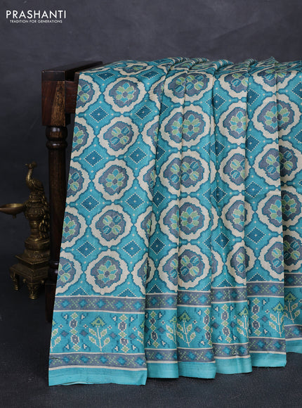 Pure tussar silk saree teal blue and grey with allover ikat prints and printed border