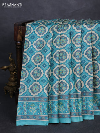 Pure tussar silk saree teal blue and grey with allover ikat prints and printed border