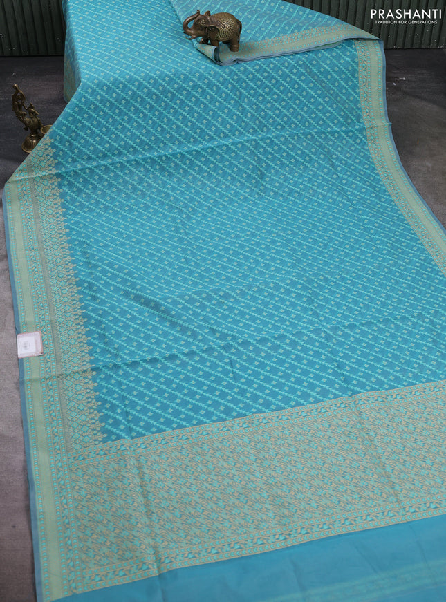 Banarasi cotton saree teal blue with allover thread weaves and woven border