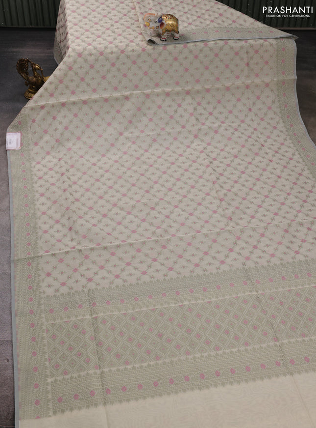 Banarasi cotton saree cream and pastel green with allover thread weaves and woven border