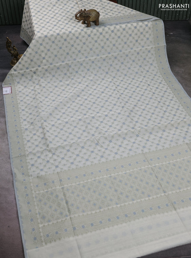 Banarasi cotton saree off white and pista green with allover thread weaves and woven border