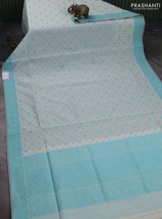 Banarasi cotton saree off white and teal blue with thread woven butta weaves and woven border