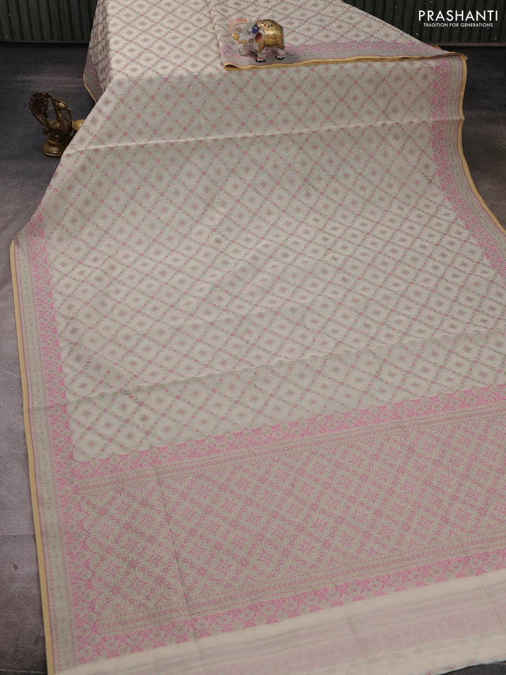 Banarasi cotton saree off white and pista green with allover thread weaves and woven border
