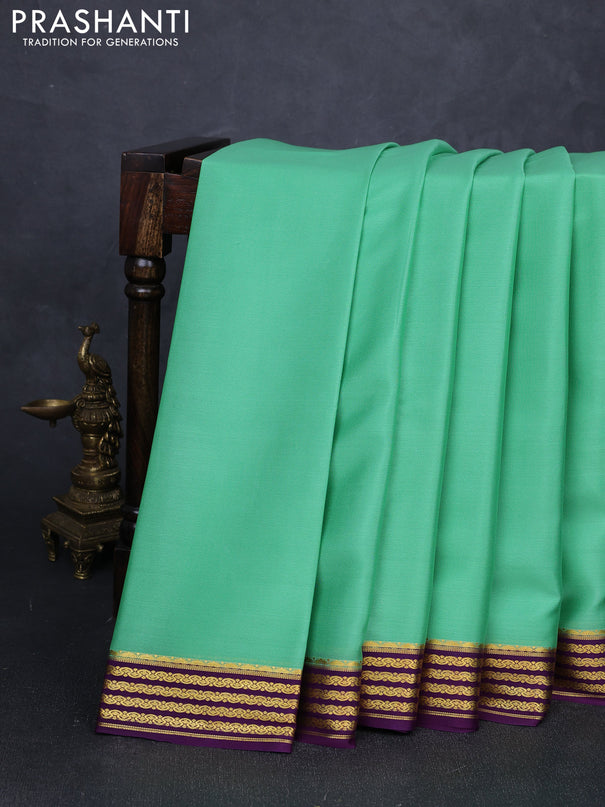 Pure mysore silk saree pista green and purple with plain body and zari woven border
