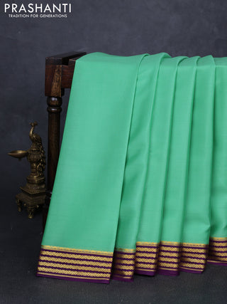 Pure mysore silk saree pista green and purple with plain body and zari woven border