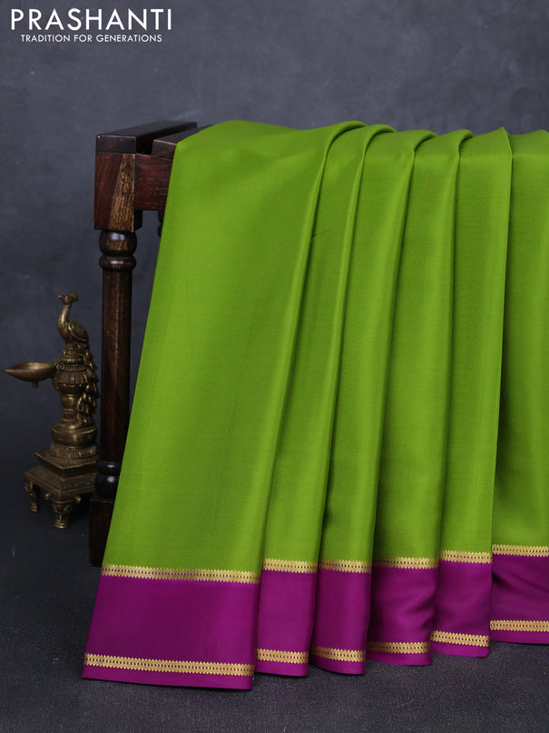 Pure mysore silk saree light green and purple with plain body and rettapet zari woven buttas